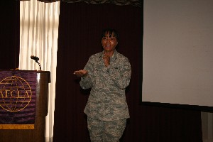 Col. Mary Gillam, USAF, director of information technology, Oklahoma City Air Logistics Center, introduces Kirk as the October meeting's guest speaker.